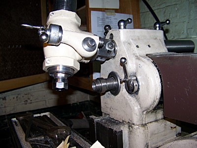 Universal vertical milling head tilted and nodded on the overarm of an Atlas horizontal milling machine